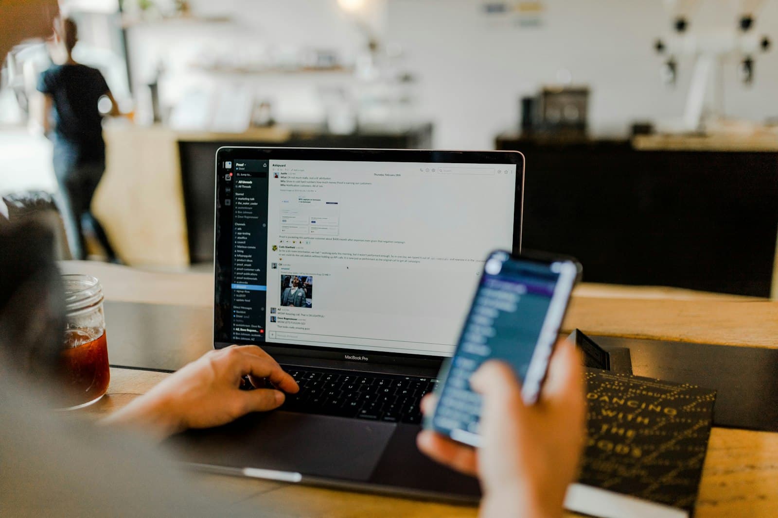 Hands typing at a laptop with a physical security key