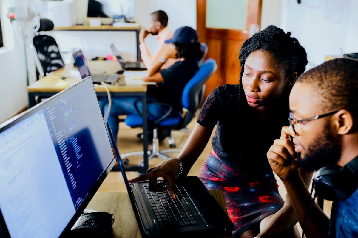Cloud engineers collaborating at their desks
